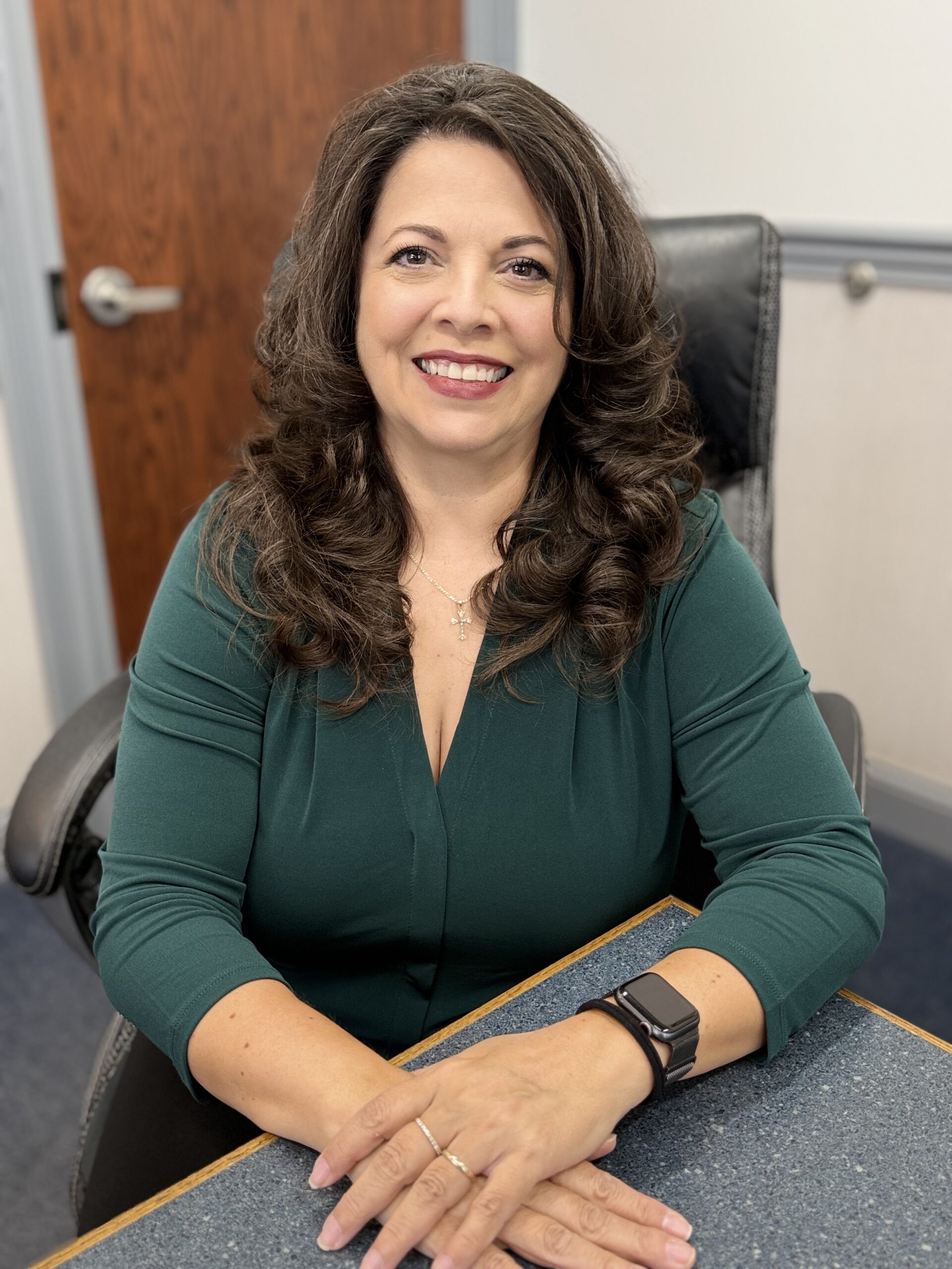 Alejandra Medley, account manager, wearing a red shirt at V.R. Williams and Company in Winchester, TN